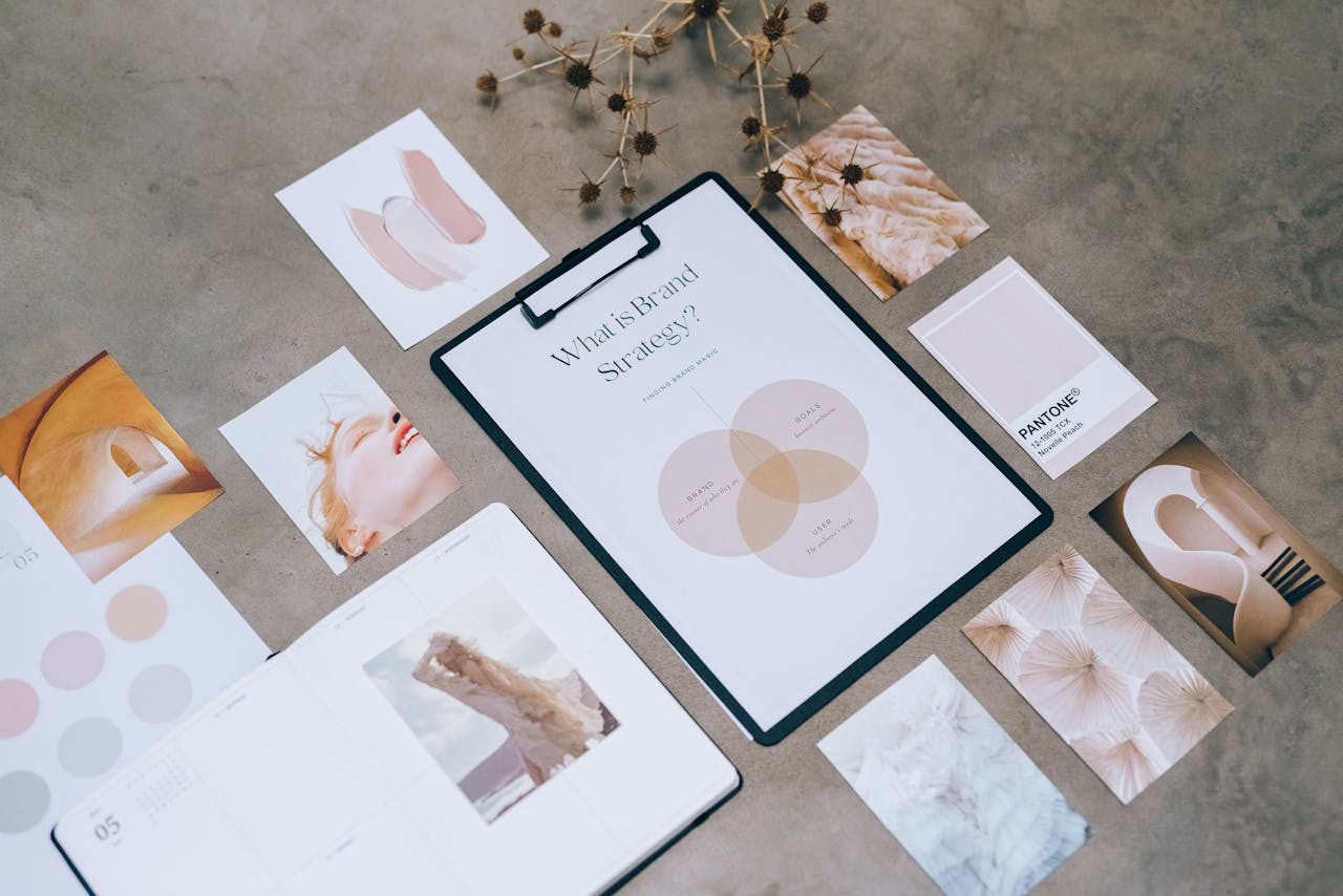our-services-2 Flat lay of a minimalist brand strategy moodboard on a concrete surface.